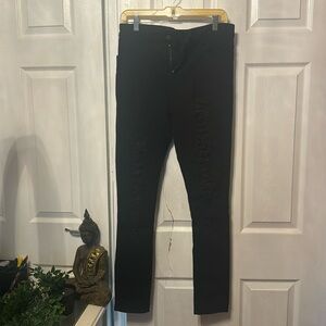Black stretchy skinny jean ripped up